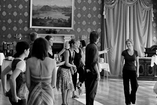 Shawn among smiling women dancers during a workshop