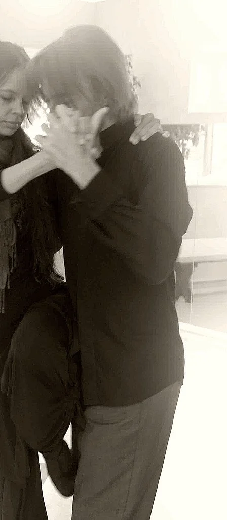 Closely cropped archive of Shawn dancing, with only a small part of his partner visible at the edge